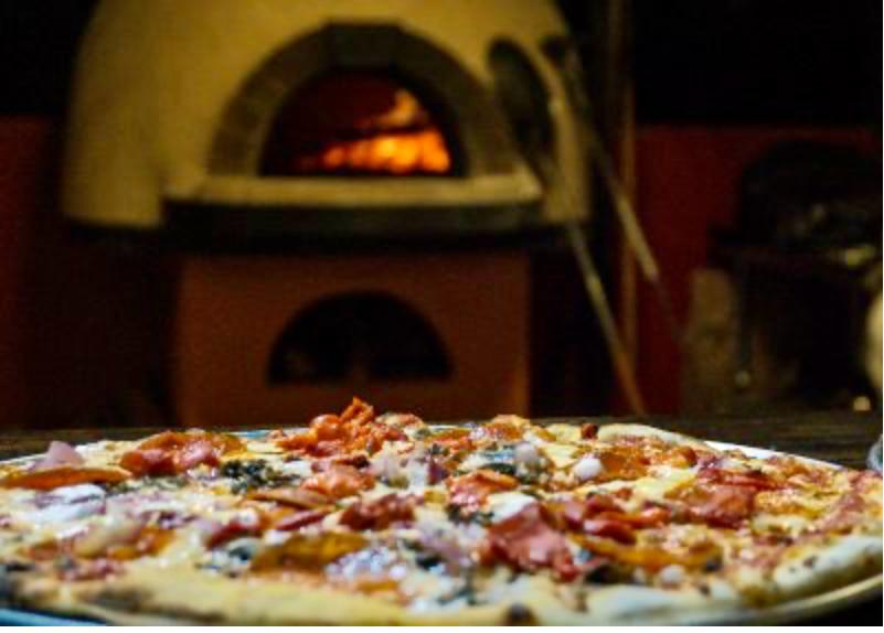Wood-fired pizza oven at Bluff Beach for group celebrations