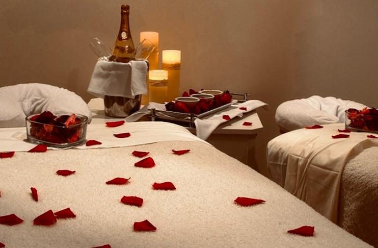 Massage table set with tropical flowers for a celebration at Bluff Beach Jungle Spa